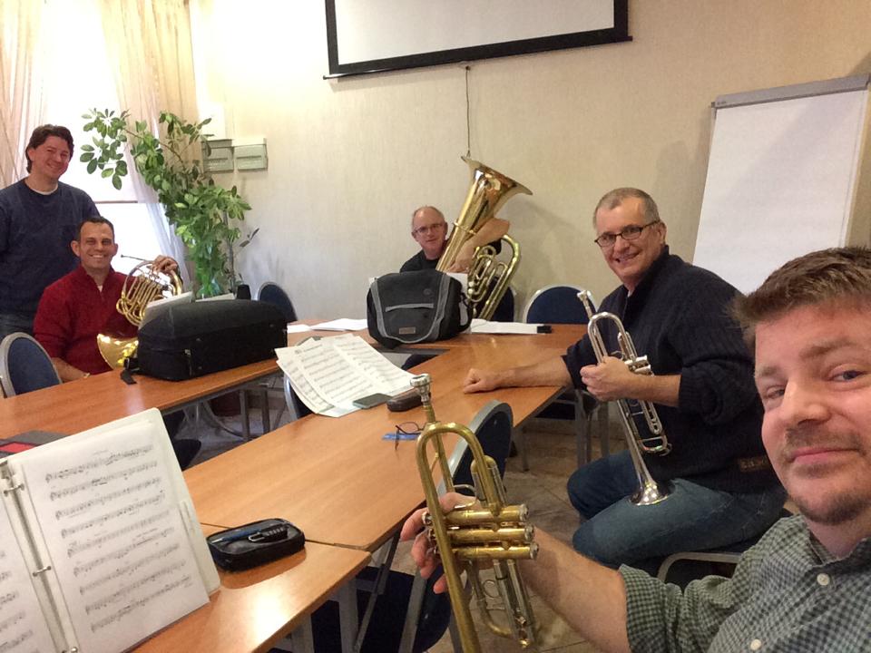 Fortress Brass rehearsing in their hotel conference room.