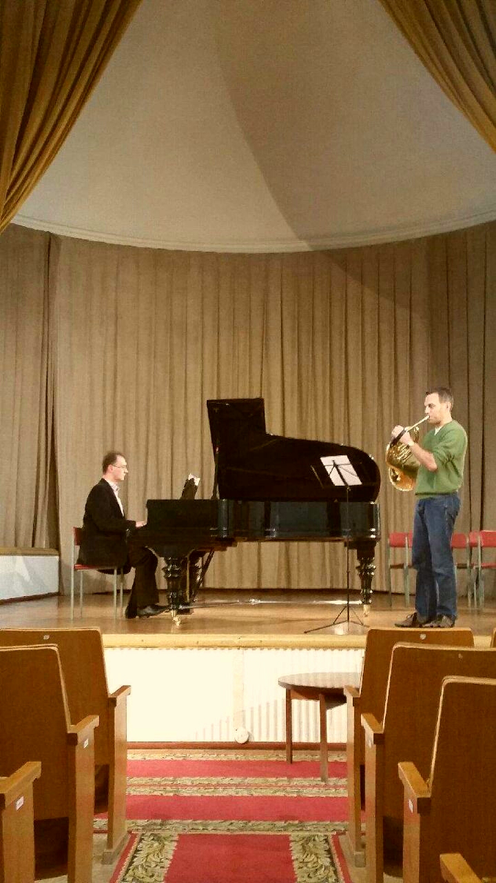 John McGuire warming up for his performance of the Telemann Horn Concerto.