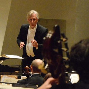 Maestro Wes Kenney pictured conducting