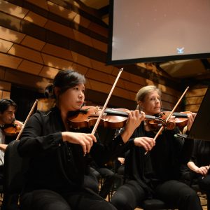 Holiday Spectacular violin section pictured