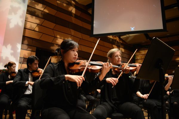 Holiday Spectacular violin section pictured