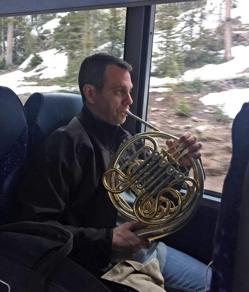 John McGuire practices on the bus ride to Grand Junction.