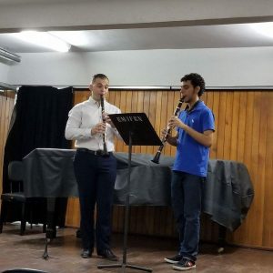 two men playing clarinets
