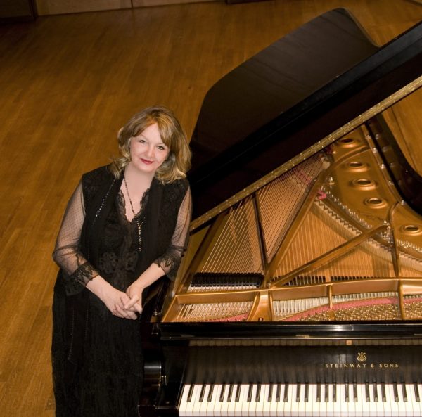 Dr. Janet Landreth pictured by a grand piano