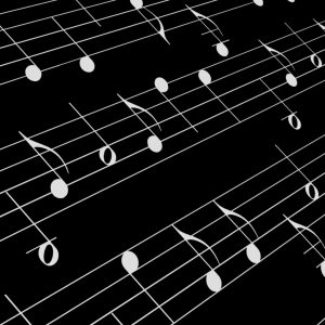 Black and white music notes on a dark background