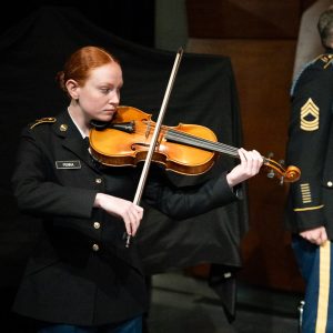 Viola student, Bella Penna plays instrument in her ROTC uniform