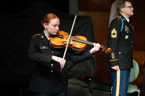 Viola student, Bella Penna plays instrument in her ROTC uniform