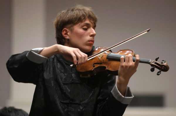 Russell Wolfe pictured playing the violin