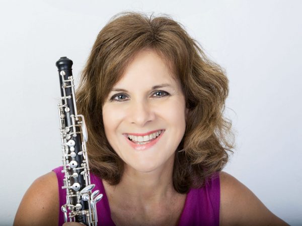 Nancy Ambrose King promotional photo with oboe