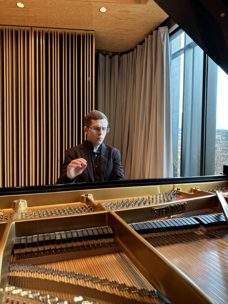 Guest Artist Helber Fernandes Ribeiro pictured at a piano