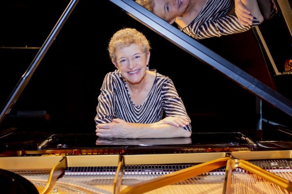 Guest Artist Theresa Bogard pictured at a piano
